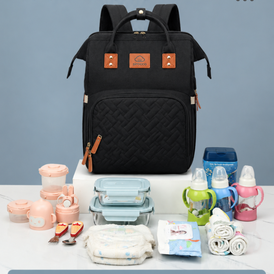Black diaper bag with baby essentials on a gray background